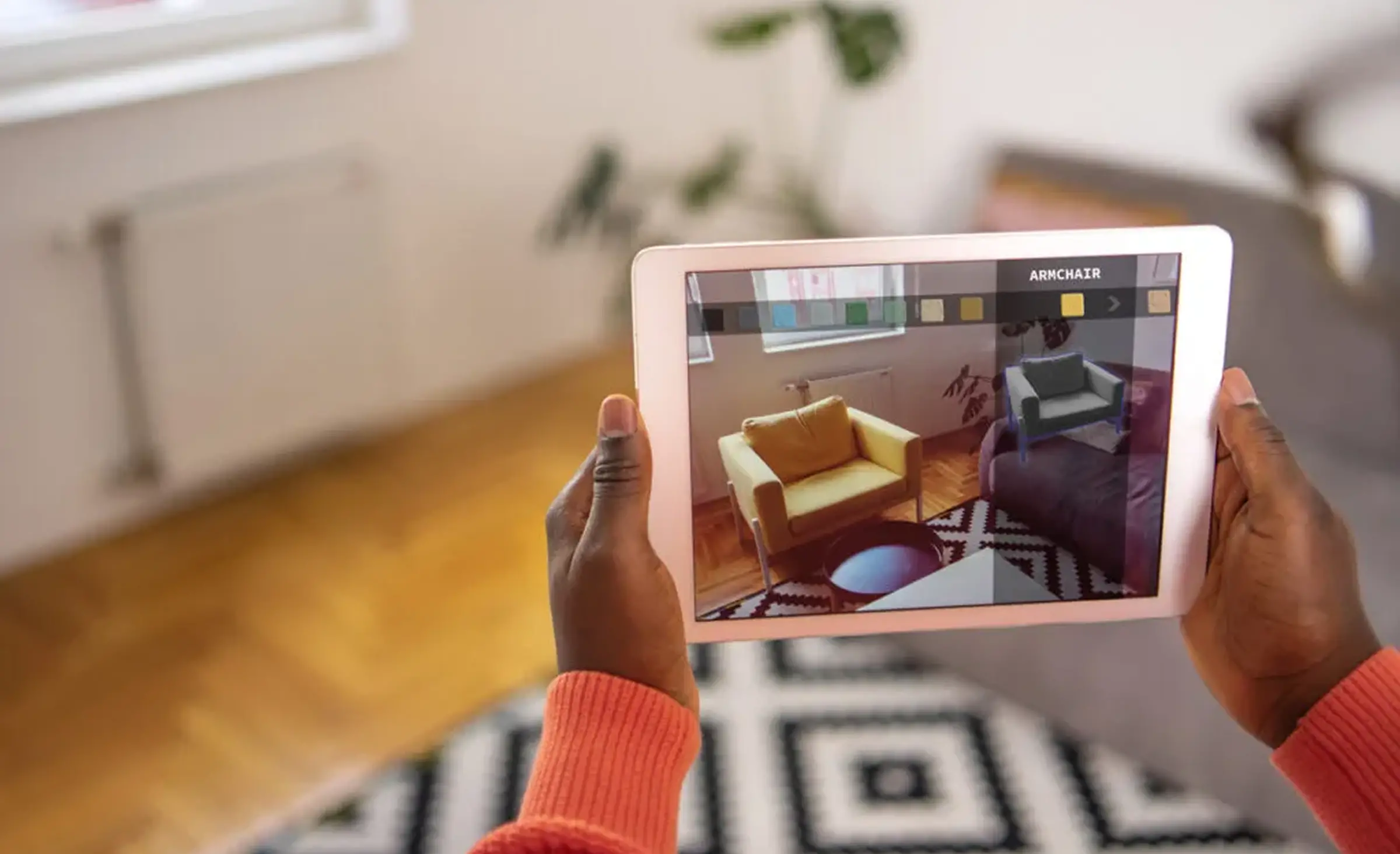 An example of using AR/VR in real estate software development - an app that shows how furniture may look in a property