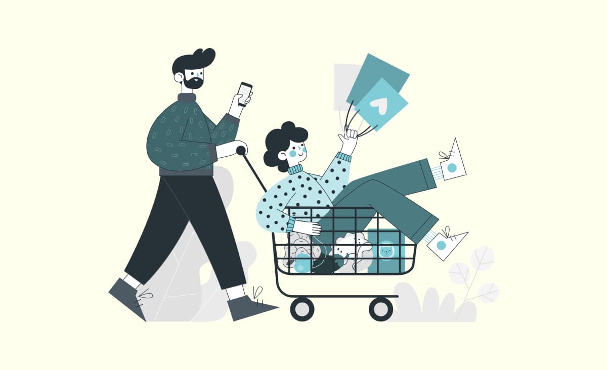 The article cover illustrates its title "How to build a custom e-commerce website." the image shows a couple: a man pushing a woman in a cart. the man is holding a phone, and the woman is holding shopping bags. in the cart where the woman is riding, there are also groceries: a bag of potatoes, an eggplant, an apple, some cauliflower, and cat food.