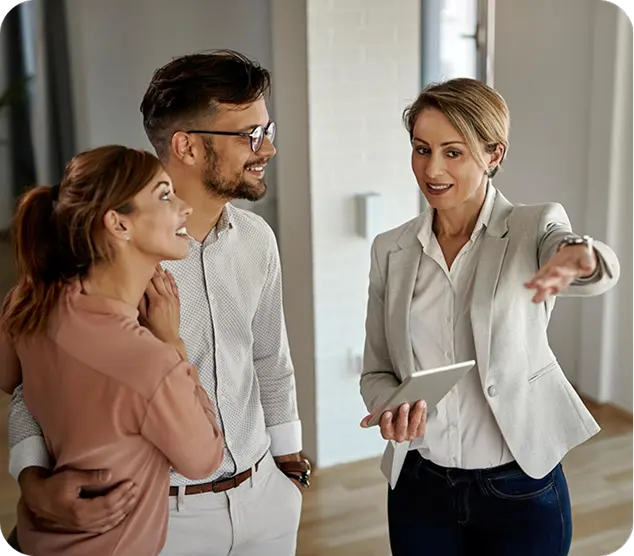 Real estate agent showing an apartment to a couple during a viewing.