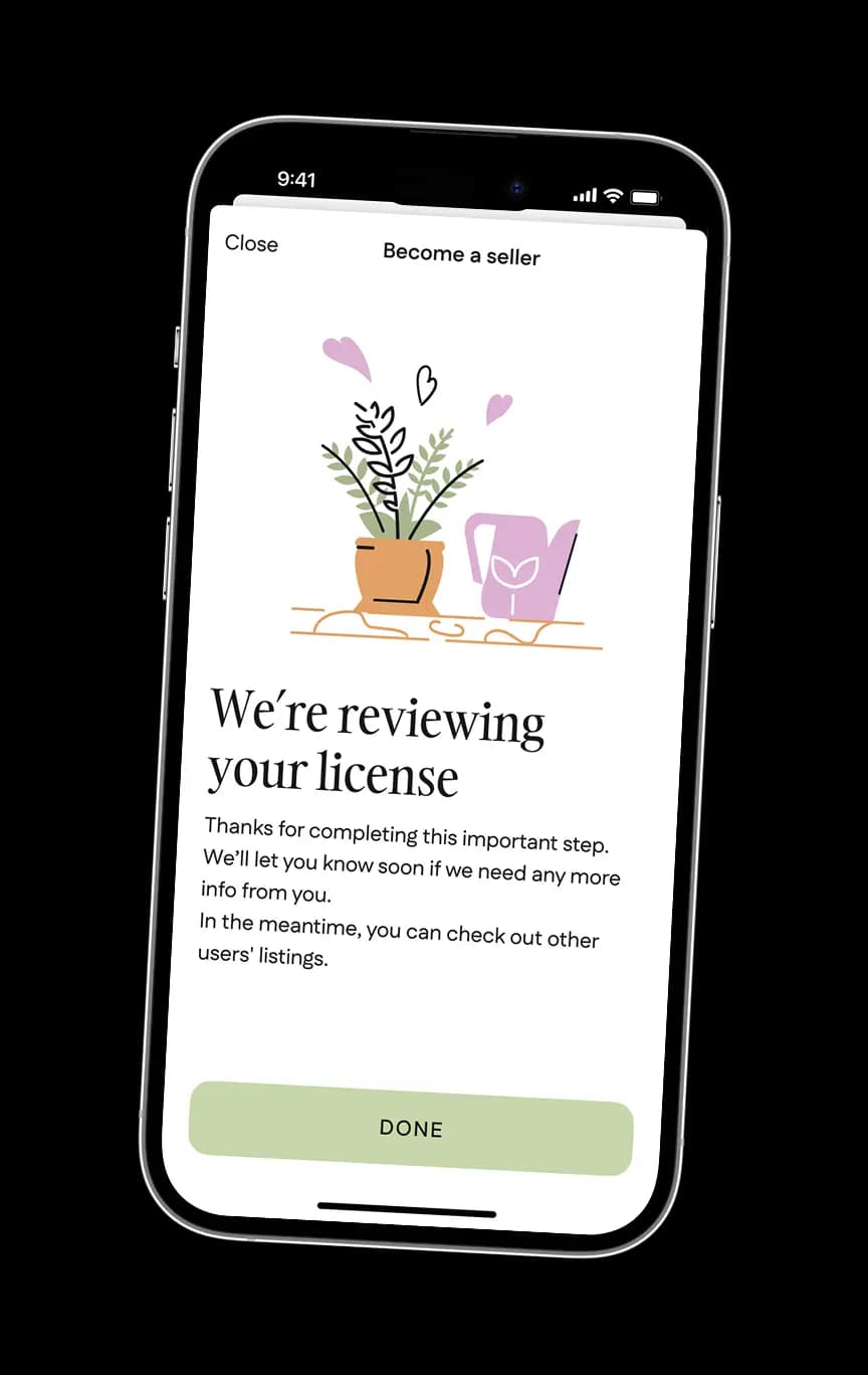 Phone screen confirming the seller's uploaded trade license is under review.