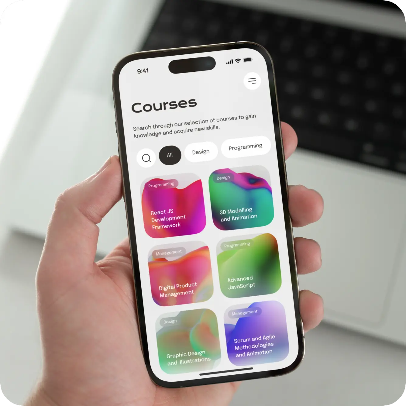 Hand holding a phone with the colorful course grid of the learning app.
