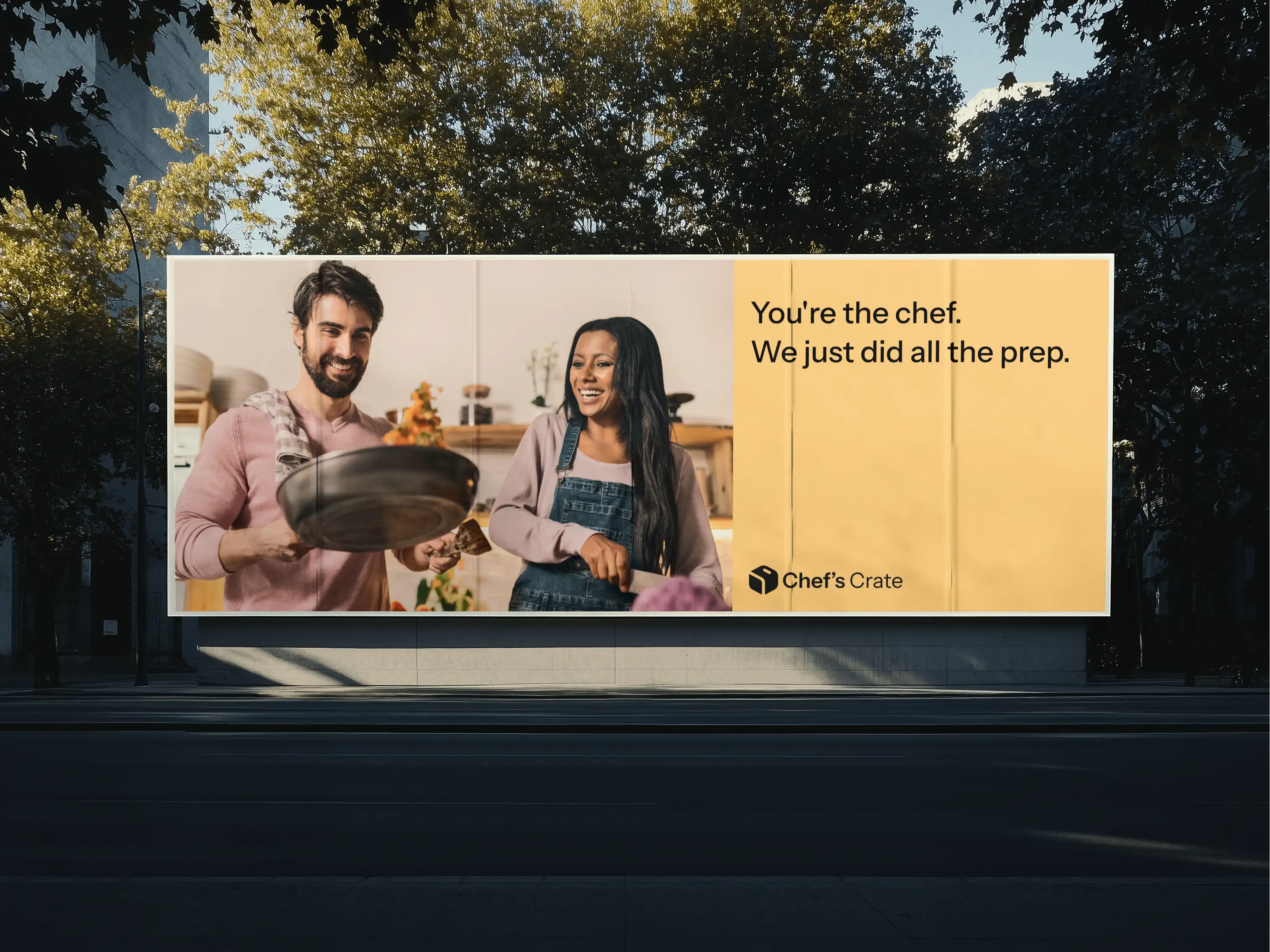 Street billboard with the Chef's Crate logo and the line “You're the chef. We just did all the prep.”, next to a photo of two people cooking.